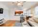 Well-lit living area showcasing hardwood floors and kitchen access, perfect for entertaining at 733 Frederica Ne St # 12, Atlanta, GA 30306
