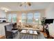 Cozy living room with a neutral sofa, large windows, and a dining nook nearby at 733 Frederica Ne St # 12, Atlanta, GA 30306