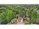Aerial view of a neighborhood with beautiful homes, well-manicured lawns and mature trees at 740 Trillium Ln, Lilburn, GA 30047