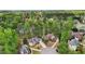 Aerial view of a neighborhood with beautiful homes, well-manicured lawns and mature trees at 740 Trillium Ln, Lilburn, GA 30047