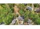Aerial view of a neighborhood with beautiful homes, well-manicured lawns and mature trees at 740 Trillium Ln, Lilburn, GA 30047