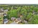 Aerial view of a neighborhood with beautiful homes, well-manicured lawns and mature trees at 740 Trillium Ln, Lilburn, GA 30047