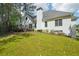 Manicured backyard lawn with a deck, ideal for outdoor enjoyment and relaxation at 740 Trillium Ln, Lilburn, GA 30047
