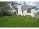 Manicured backyard lawn with a deck, ideal for outdoor enjoyment and relaxation at 740 Trillium Ln, Lilburn, GA 30047