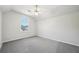 Bright bedroom with a vaulted ceiling and a large window at 740 Trillium Ln, Lilburn, GA 30047