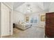 The bedroom has neutral colors, carpet flooring, and a ceiling fan for comfort at 740 Trillium Ln, Lilburn, GA 30047
