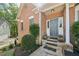 Inviting front entrance featuring a gray front door, stone steps, and lush landscaping at 740 Trillium Ln, Lilburn, GA 30047