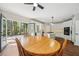 Bright kitchen with white cabinets, an island with a gas cooktop, and an adjacent breakfast area at 740 Trillium Ln, Lilburn, GA 30047