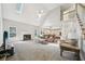 Bright, open living room with vaulted ceilings, fireplace, and view to the kitchen at 740 Trillium Ln, Lilburn, GA 30047