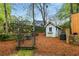 Landscaped backyard with a chicken coop and an arbor at 1643 Wade Ne Ave, Atlanta, GA 30317