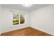 This bedroom features hardwood floors and a window view of the neighborhood at 1643 Wade Ne Ave, Atlanta, GA 30317