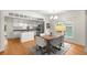 Dining area featuring hardwood floors, natural light, and views into the kitchen at 1643 Wade Ne Ave, Atlanta, GA 30317