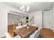 Open-concept dining room leading to a living room with hardwood floors and neutral decor at 1643 Wade Ne Ave, Atlanta, GA 30317