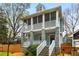 Inviting two-story home with double screened porches and stone accents in a leafy setting at 1643 Wade Ne Ave, Atlanta, GA 30317