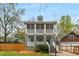 Inviting two-story home with double screened porches, and a detached garage in a leafy setting at 1643 Wade Ne Ave, Atlanta, GA 30317