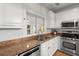 Bright kitchen featuring stainless steel appliances, gas range, and natural light at 1643 Wade Ne Ave, Atlanta, GA 30317