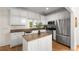 Kitchen with an island, stainless steel appliances, and white cabinets at 1643 Wade Ne Ave, Atlanta, GA 30317