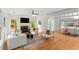 Bright and airy living room with a fireplace, hardwood floors, and an open floor plan at 1643 Wade Ne Ave, Atlanta, GA 30317