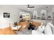 Open concept living room with hardwood floors, ceiling fan, and view into the dining and kitchen areas at 1643 Wade Ne Ave, Atlanta, GA 30317