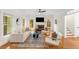 Sun-filled living room features a fireplace, hardwood floors and neutral decor at 1643 Wade Ne Ave, Atlanta, GA 30317