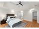 This main bedroom features hardwood floors, a ceiling fan and access to the main bath at 1643 Wade Ne Ave, Atlanta, GA 30317