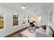 Bright sunroom with lots of natural light, hardwood floors and modern furnishings at 1643 Wade Ne Ave, Atlanta, GA 30317