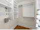 This walk-in closet features custom shelves and racks for optimal storage at 1643 Wade Ne Ave, Atlanta, GA 30317