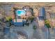 Aerial view showcasing the home's in-ground pool, patio, backyard, and driveway at 1909 Hickory Level Rd, Villa Rica, GA 30180