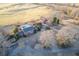 Expansive aerial view showcasing the home, pool, barn, and surrounding lush landscape at 1909 Hickory Level Rd, Villa Rica, GA 30180