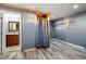 Spacious unfinished bedroom with an adjoined bathroom and new flooring at 1909 Hickory Level Rd, Villa Rica, GA 30180