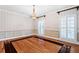 Formal dining room with hardwood floors, chandelier, and elegant wall decor at 1909 Hickory Level Rd, Villa Rica, GA 30180