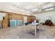 Spacious garage featuring unfinished walls, concrete flooring, and ample workspace with modern lighting fixtures at 1909 Hickory Level Rd, Villa Rica, GA 30180