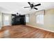 Living room with hardwood floors, windows with custom valances and a built-in media center at 1909 Hickory Level Rd, Villa Rica, GA 30180