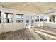 Bright sunroom with vaulted ceilings, tile floors, and walls of windows with beautiful outdoor views at 1909 Hickory Level Rd, Villa Rica, GA 30180