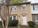 Charming townhouse featuring a light exterior, well-maintained landscaping, and a welcoming front entrance at 2834 Royal Path Ct, Decatur, GA 30030