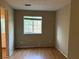Bedroom with laminate wood floors and a window with a view at 2834 Royal Path Ct, Decatur, GA 30030