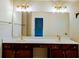 Bright bathroom features a double sink vanity with dark wood cabinets and white countertops at 2930 Smith Ridge Trce, Peachtree Corners, GA 30071