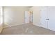 Bedroom with neutral carpet, a double door closet, and plenty of natural light at 2930 Smith Ridge Trce, Peachtree Corners, GA 30071