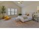 Bedroom with vaulted ceilings, a ceiling fan, and a large window for ample natural light at 2930 Smith Ridge Trce, Peachtree Corners, GA 30071