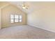 Bright bedroom featuring vaulted ceilings, neutral carpet, and a large window at 2930 Smith Ridge Trce, Peachtree Corners, GA 30071
