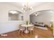 Staged dining room features table set with chairs, hardwood flooring, and view to living room at 2930 Smith Ridge Trce, Peachtree Corners, GA 30071