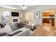 Staged living room with fireplace, hardwood floors, and furniture at 2930 Smith Ridge Trce, Peachtree Corners, GA 30071