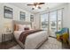 Inviting bedroom with hardwood floors, natural light, a plush bed and decorative accents at 901 Abernathy Ne Rd # 3200, Atlanta, GA 30328