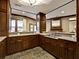 Kitchen area with wood cabinets, countertop, and tile flooring at 901 Abernathy Ne Rd # 3200, Atlanta, GA 30328