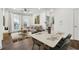 Cozy living room with a ceiling fan, neutral color palette, hardwood floors and a view of the outside through the window at 901 Abernathy Ne Rd # 3200, Atlanta, GA 30328