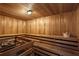 Luxurious wooden sauna featuring wooden benches, wall lighting and stones at 901 Abernathy Ne Rd # 3200, Atlanta, GA 30328