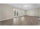 Finished basement featuring wood laminate flooring, neutral colors, and natural light at 3100 Templeton Ln, Loganville, GA 30052