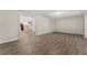 Spacious finished basement with wood laminate flooring, offering potential for versatile use at 3100 Templeton Ln, Loganville, GA 30052