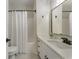 Bathroom with white vanity, quartz countertop, modern fixtures, and shower/tub combo at 3100 Templeton Ln, Loganville, GA 30052