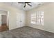 Bedroom with double closet doors, a ceiling fan, and a window for ample natural light at 3100 Templeton Ln, Loganville, GA 30052